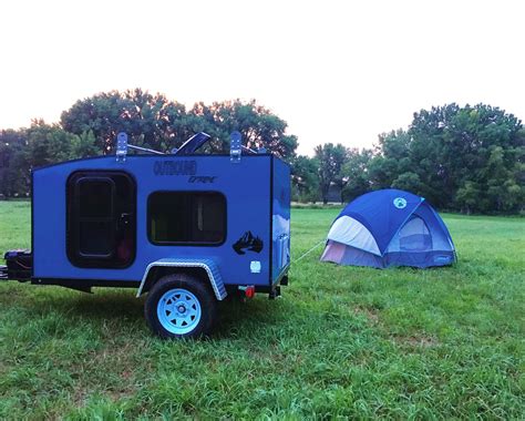 All set up for camping!! Didnt even know the tent matched the trailer ...