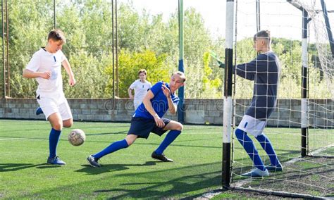 Teens Playing Soccer Football Match. Competition between Two Youth ...