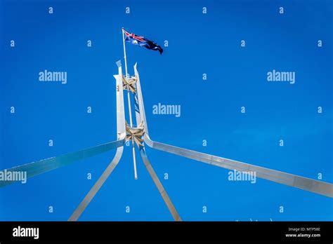 Australian flag flying on top of the Parliament House in Canberra Stock Photo - Alamy