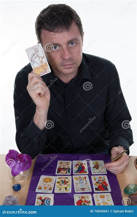 Male Fortune Teller Using Tarot Cards on Purple Table Stock Image ...