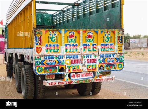 Driving in India: view of a typical brightly coloured back of an Indian ...