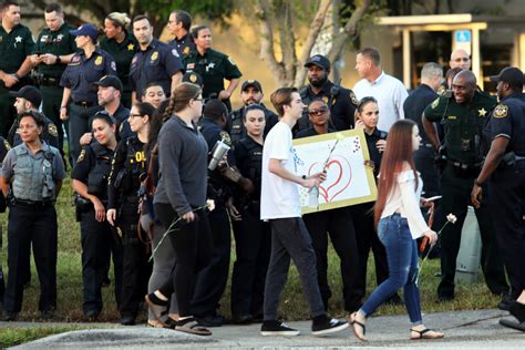 Photos: Marjory Stoneman Douglas High reopens after shooting | PBS News