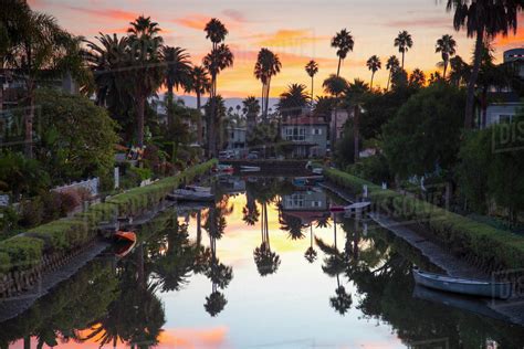 One of famous canals at sunset, Venice Beach, Los Angeles, California, USA - Stock Photo - Dissolve