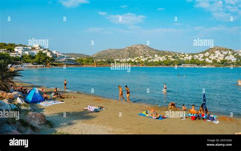 Vouliagmeni, Greece - September 1, 2022: People enjoying the good weather in Vouliagmeni beach ...