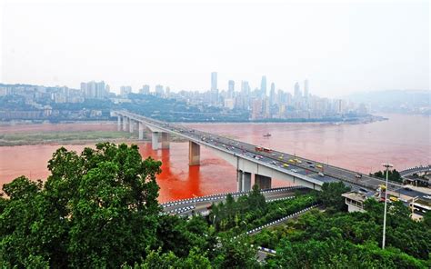 Red China: a section of the Yangtze River turns red in Chongqing, China