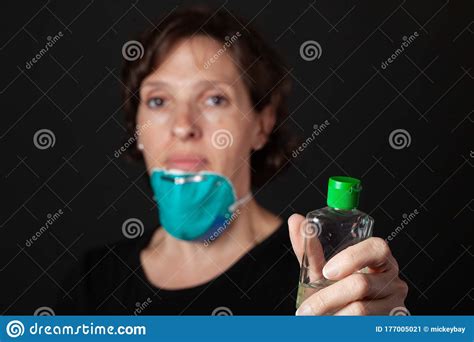 Hand Sanitizer - Woman with Hospital Grade Mask Using Hand Sanitizer Stock Image - Image of ...