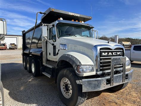 2023 MACK GR64F Dump Truck - J.M. Wood Auction Company, Inc.