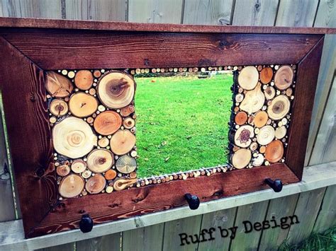 Hallway hanger filled with wood slices and repurposed railroad spikes for hooks #ruffbydesign ...