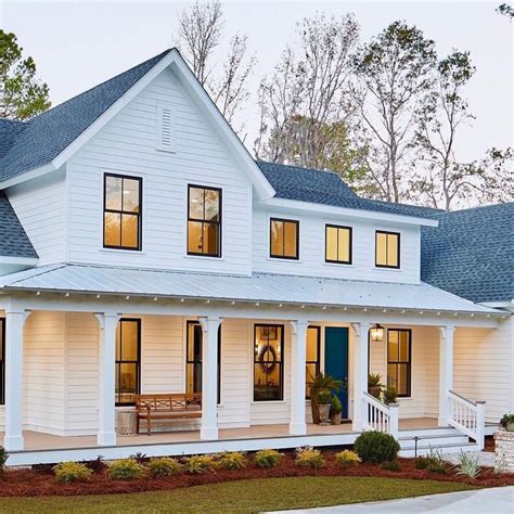 Home Bunch on Instagram: “Modern farmhouse: White siding, black windows and a big fro ...