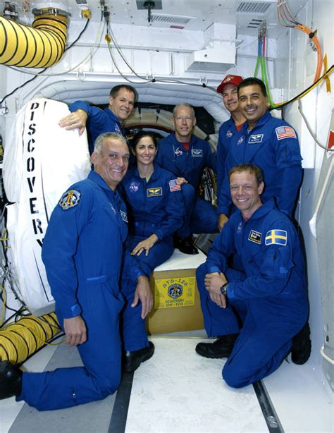 Space in Images - 2009 - 08 - STS-128 crew with Space Shuttle Discovery ...