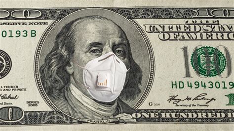 Face of american president in medical mask on dollar bill during ...