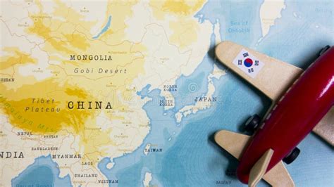 A Map of South Korea and a Red Plane with a Flag of South Korea ...