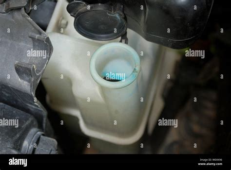 Car radiator system Maintenance of opening the radiator cap Car cooling system Stock Photo - Alamy