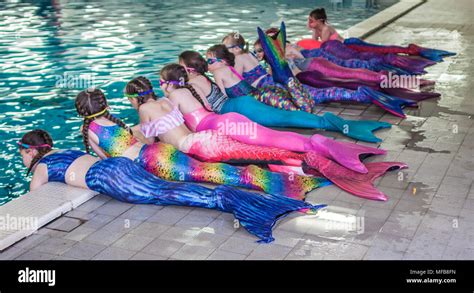 Mermaids in a swimming pool Stock Photo - Alamy