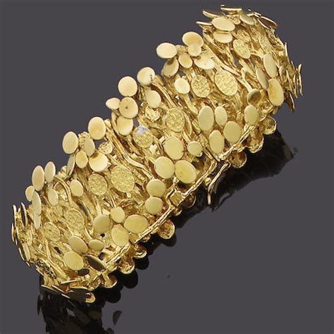 Bonhams : An 18 carat yellow gold bracelet,