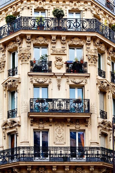 an ornate building with balconies and windows