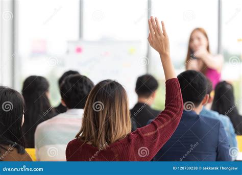 Student Raising Hand Up in a Classroom. Stock Photo - Image of audience ...