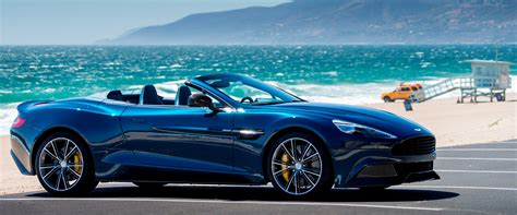 Blue and convertible Aston Martin Vanquish Volante