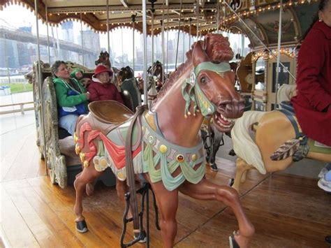 a merry go round with people riding on it