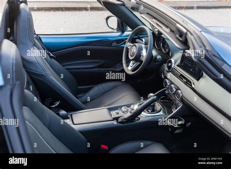 Interior view of a new, blue 2020 Mazda MX-5 Miata GT RF with black ...