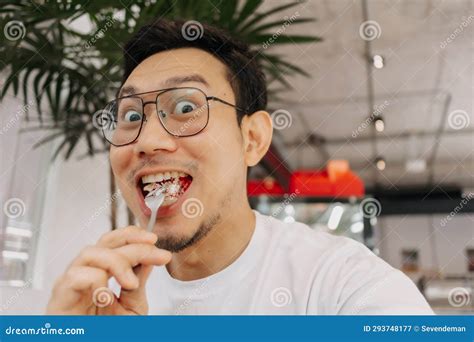 Funny Happy Face of Man Eating and Putting Cake into His Mouth. Stock ...