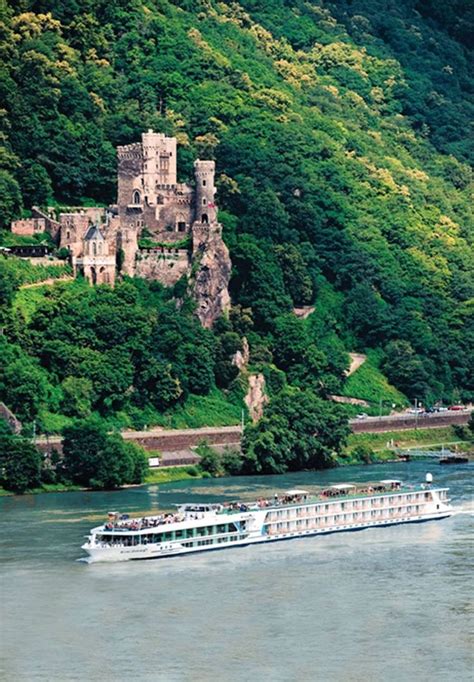 Cruise passing by the Rheinstein Castle standing 300 feet above the Rhine River - Rhineland ...