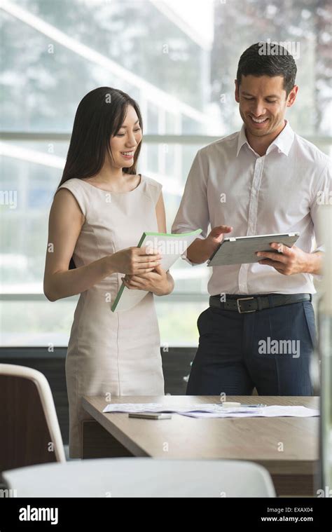 Business professionals sharing ideas Stock Photo - Alamy