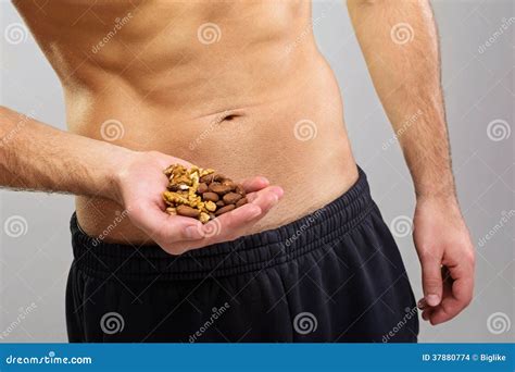 Closeup Of Young Man Holding Organic Nuts Stock Images - Image: 37880774