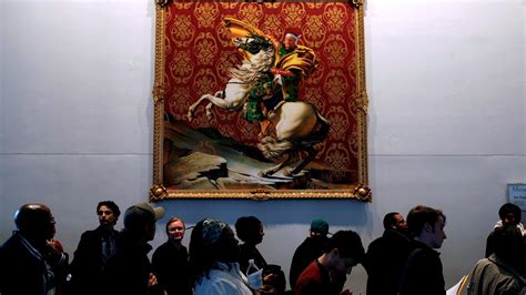 A long line of voters moves slowly past a painting by Kehinde Wiley at a polling site in the ...
