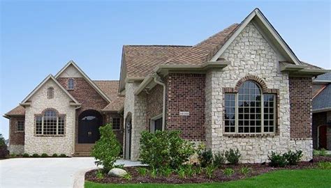 This home is created with Hebron's Castlewood brick and accented with stone giving it character ...