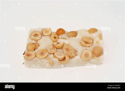 Soft coconut candy covered with hazelnuts, Egyptian cultural desserts of prophet Muhammad birth ...