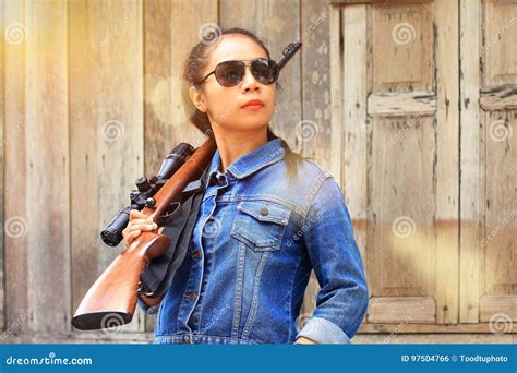 Woman with a sniper rifle stock photo. Image of nature - 97504766