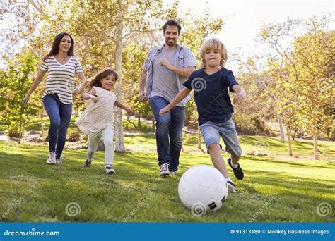 Family Playing Soccer in Park Together Stock Photo - Image of female, outdoors: 91313180