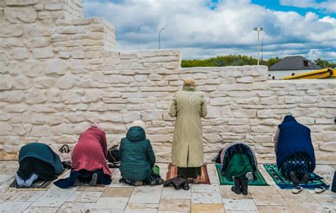 Muslim Women Pray. Namaz. Women Praying at the Stone Wall Stock Photo ...