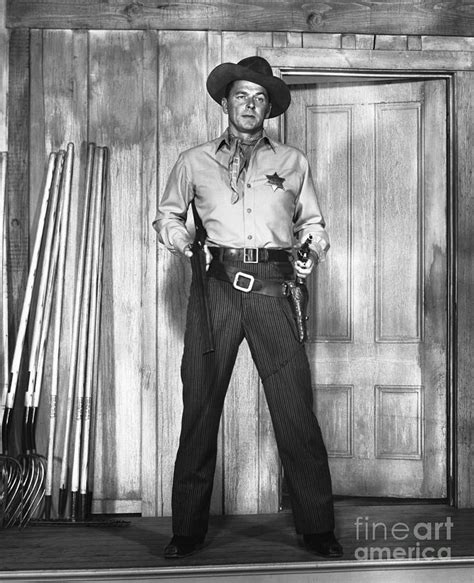 Ronald Reagan Dressed As Cowboy In Movie by Bettmann