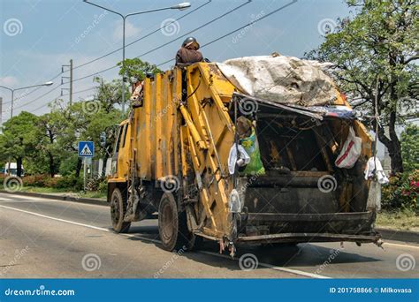 The Garbage Man Sits on a Garbage Truck Driving Down Bangkok Street Editorial Photo - Image of ...