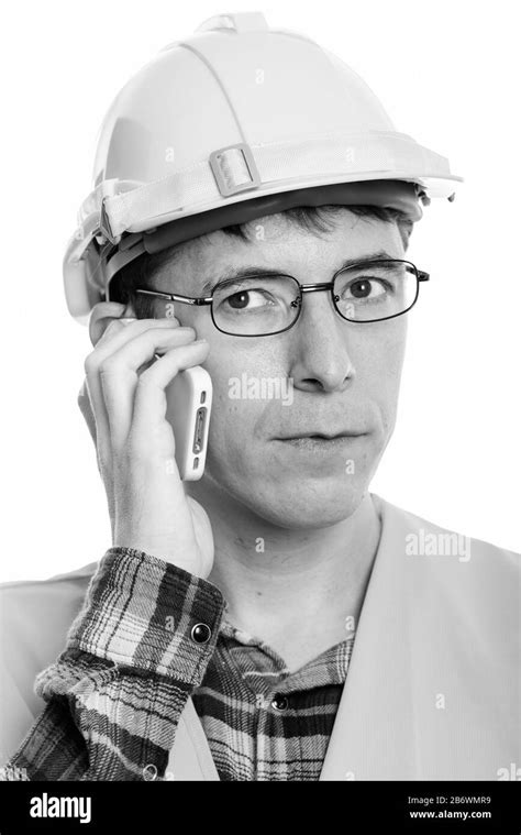 Face of man construction worker talking on the phone Stock Photo - Alamy