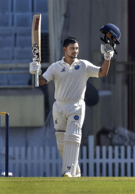 Ishan Kishan raises his bat after reaching a century | ESPNcricinfo.com