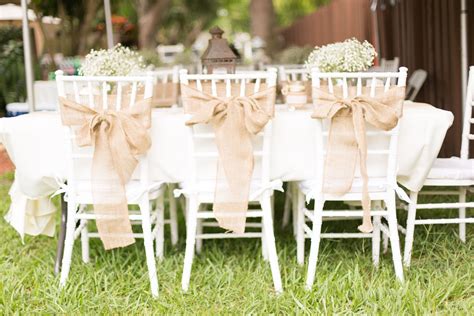 White Chiavari Reception Chairs with Burlap Sashes