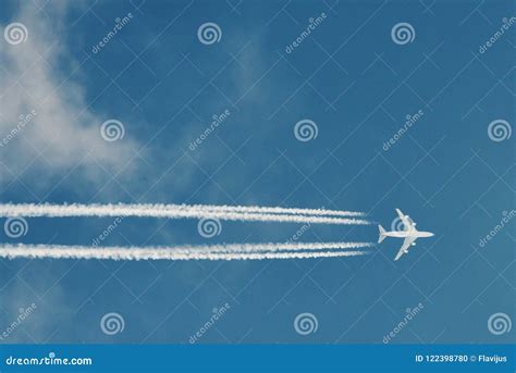 Airplane with Plane Trails stock photo. Image of journey - 122398780