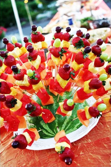 Fruit skewers for a summer event displayed in a watermelon | Fruit skewers, Food, Fruit kabobs