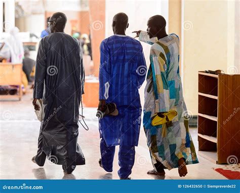 Unidentified Senegalese People in Long Traditional Clothes Walk ...