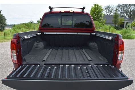 How Do You Remove The Bed Extender On A Nissan Frontier? - Truckile