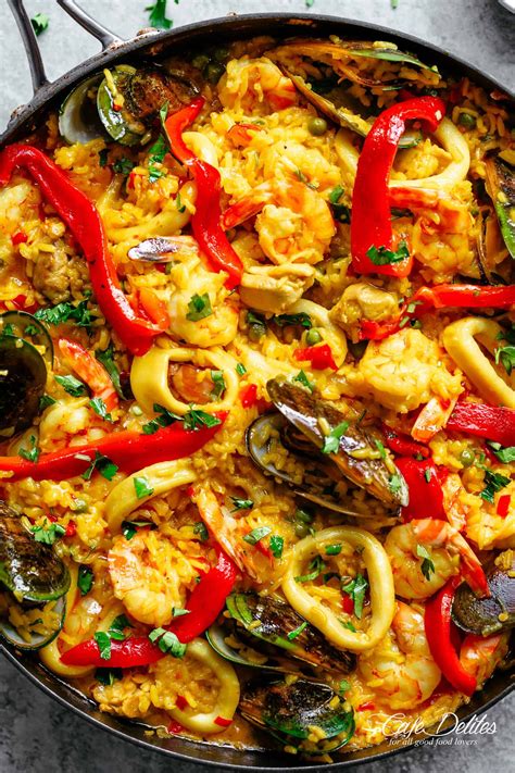 Classic Spanish Paella | https://cafedelites.com Fish Recipes, Seafood Recipes, Mexican Food ...