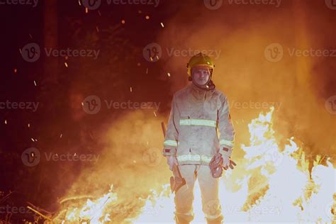 Firefighter in action 11613509 Stock Photo at Vecteezy