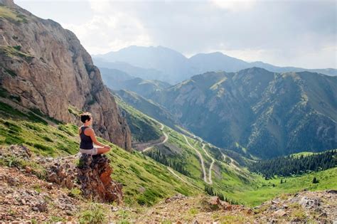 Premium Photo | Woman doing yoga in the mountains