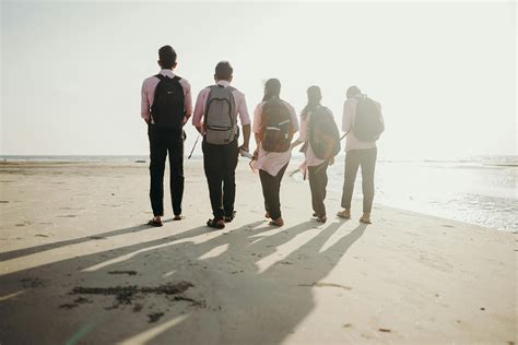 Group of People Walking on Beach · Free Stock Photo