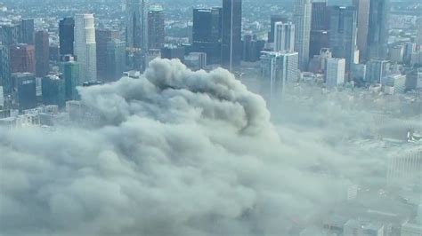 Plume of smoke seen for miles after massive fire erupts in downtown Los ...