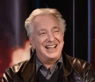 an older man wearing a leather jacket and smiling