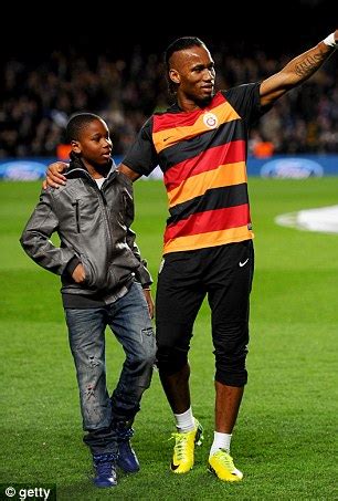 Didier Drogba celebrates with son Isaac in Chelsea dressing room after ...